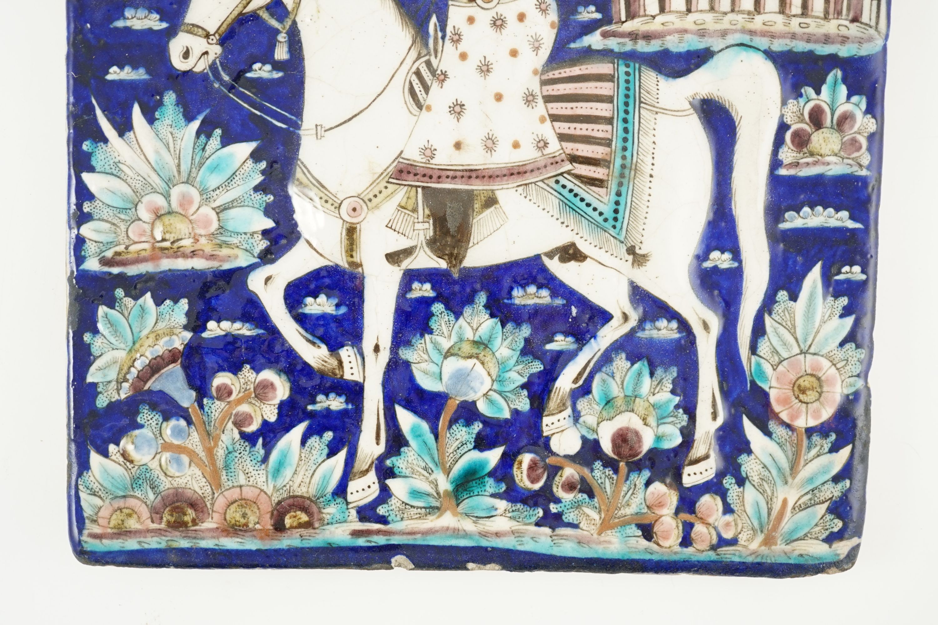 A Persian polychrome tile, Qajar dynasty - 34.5 x 27cm 34 cm x 27.5 cm